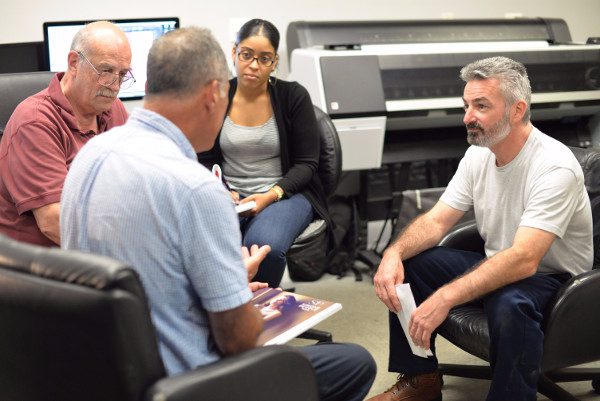 Nextwave Web team discussing a printing project